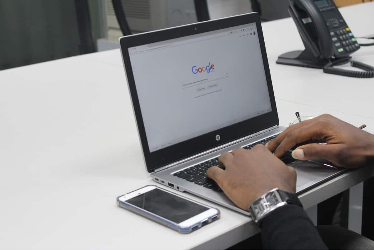 Man Searching Google on his Laptop