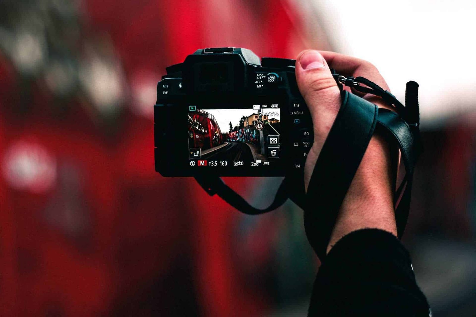 man holding camera taking photo