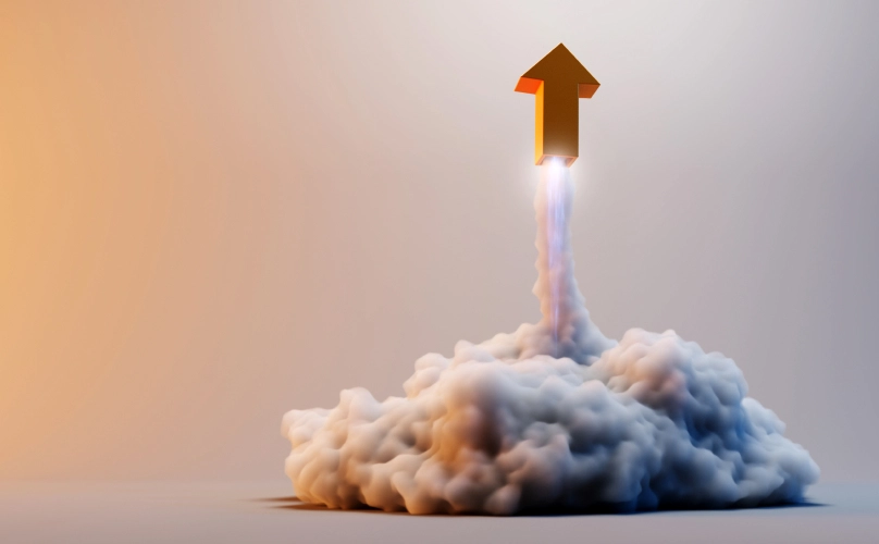 Orange arrow blasting off of the ground like a rocket ship.