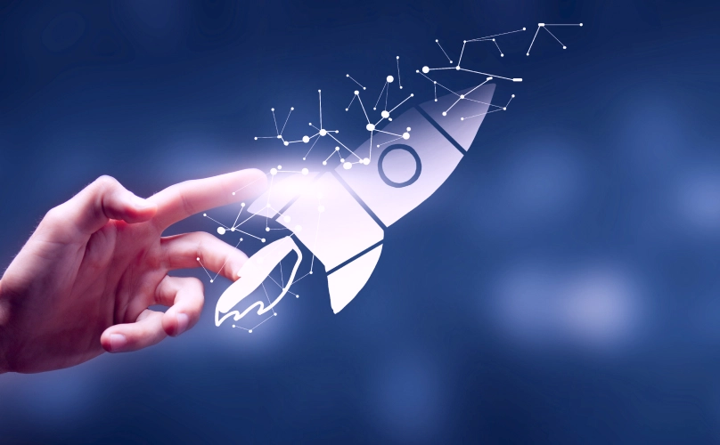 Graphic of a rocket ship being guided by a hand.