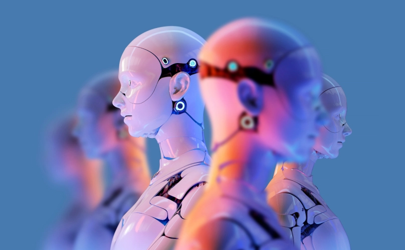 A line of human-looking robots, lit up by a warm light coming from the left.