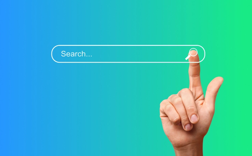 Finger clicking "Search" on a search bar.