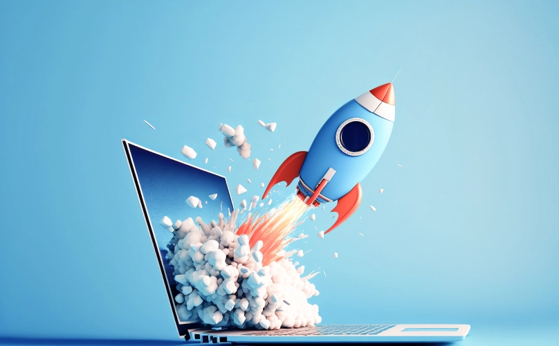 Graphic of a rocket ship coming out of a laptop screen.